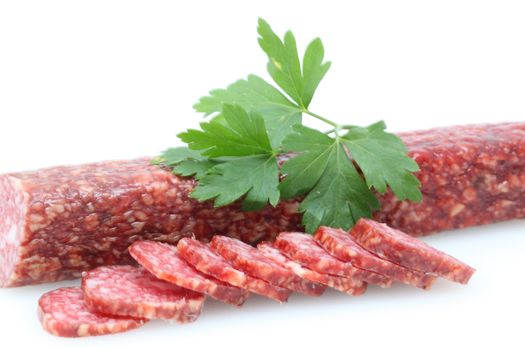 sausages and parsley on a white background