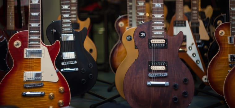 View of many guitars in the shop