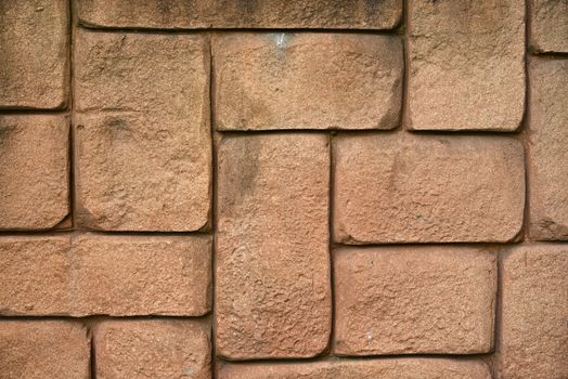 Wall of brown bricks. Close up construction background
