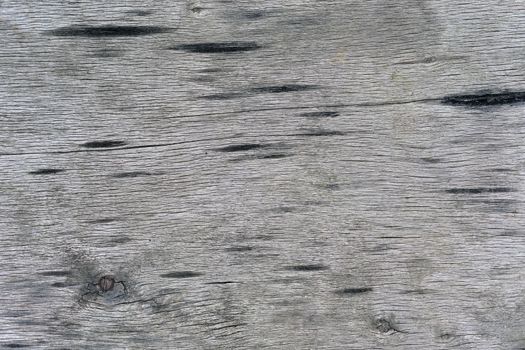 Old and dirtied wooden surface. The gray color