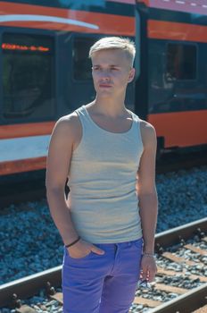 Young man on the background of the train
