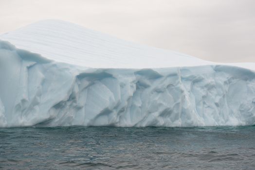 Detail of a beautiful iceberg in arctic waters around Disko Island in Greenland