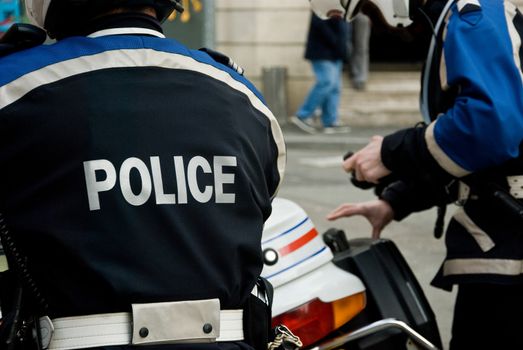 french policeman with motorcycle back