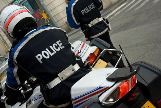 french policeman with motorcycle back