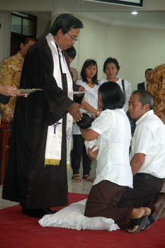 bandung, indonesia-december 19, 2010: Baptism - a christian rite of admission and almost invariably with the use of water, into the christian church generally and also a particular church tradition.