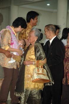 bandung, indonesia-december 19, 2010: church congregants that attend baptism ceremonial.