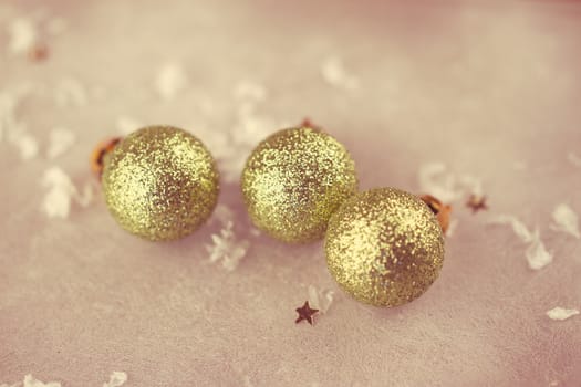 green christmas bauble on artificial snow with white background