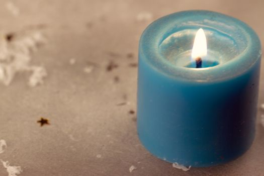 Christmas candles with evergreen decorations and snow