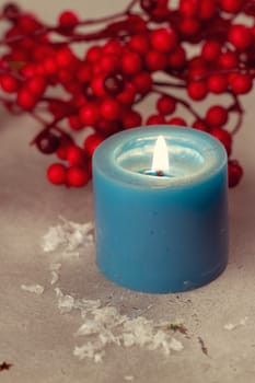 Christmas candles with evergreen decorations and rowan
