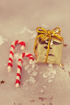 Christmas holiday candy sticks on snowy background