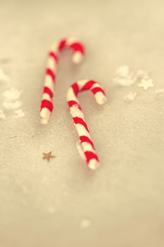 Christmas holiday candy sticks on snowy background