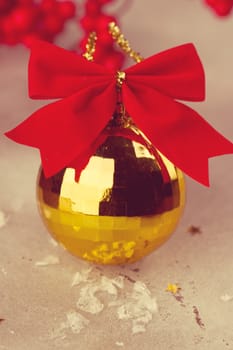 Gold Christmas ball on a white background