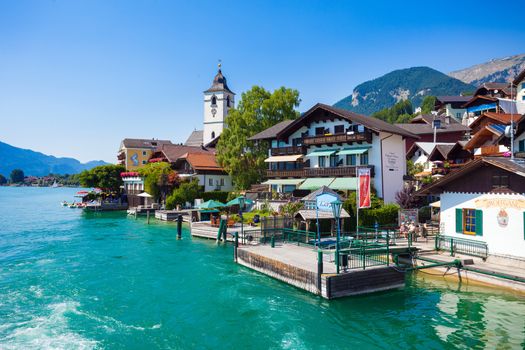 View of View of St. Wolfgang chapel and the village waterfront at Wolfgangsee lake, Austria