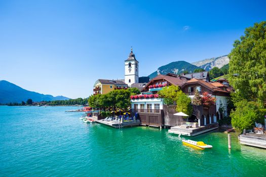View of View of St. Wolfgang chapel and the village waterfront at Wolfgangsee lake, Austria