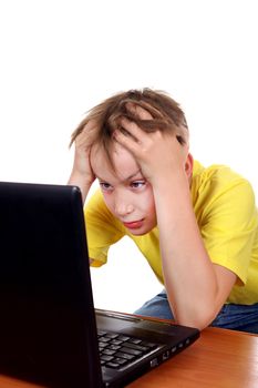 Troubled Kid at the Desk with Laptop Isolated on the White Background