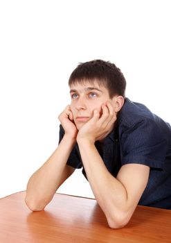 Pensive Teenager is Thinking on the Desk Isolated on the White Background