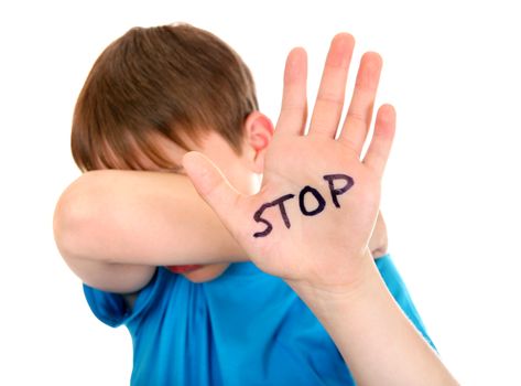 Sad Kid shows the palm gesture with an inscription STOP. Focus on the Palm