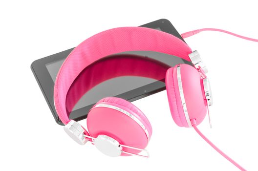 Vibrant pink female headphones and tablet pc for language course learning isolated on white