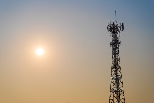 Wireless Communication Pole Beside The Sun in The Evening