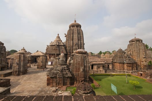 Lingaraja Hindu Temple complex. Ornately carved buildings inside a walled compound. Bhubaneswar, Orissa, India. 11th Century AD