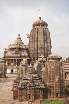 Lingaraja Hindu Temple complex. Ornately carved buildings inside a walled compound. Bhubaneswar, Orissa, India. 11th Century AD