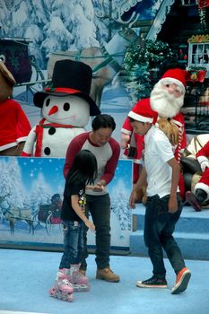 bandung, indonesia-december 17, 2011: girl learning inline skate at bandung supermall venue.
