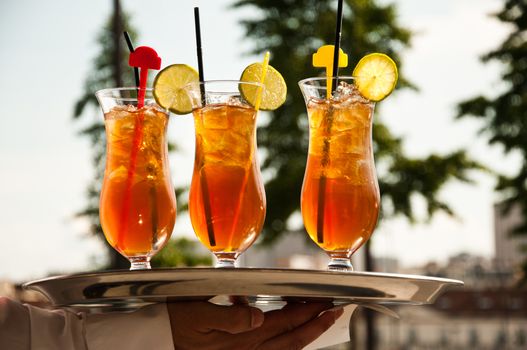 glasses of ice tea with lemon in outdoor terrace