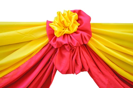 Red and yellow fabric ribbon for ceremony isolated on white.
