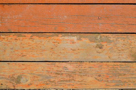 Painted wooden boards with nails. The orange color