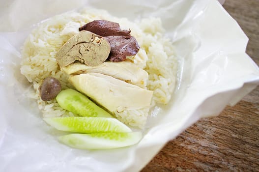 Steamed chicken with rice inside paper package