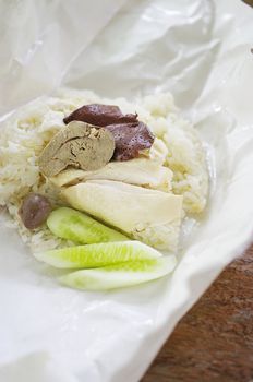 Steamed chicken with rice inside paper package