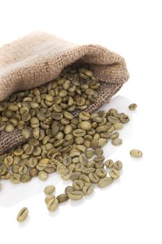 Green coffee beans in burlap bag isolated on white background. Dietary supplements, appetite suppressant. Weight loss concept.