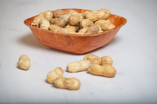 Peanuts in a brown bowl