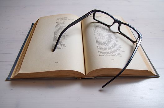 Reading glass on an old book