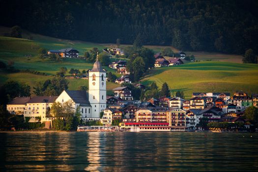 View of St. Wolfgang village waterfront at Wolfgangsee lake at sunset, Austria
