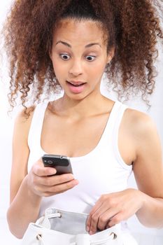Surprise - dark skinned girl reads sms