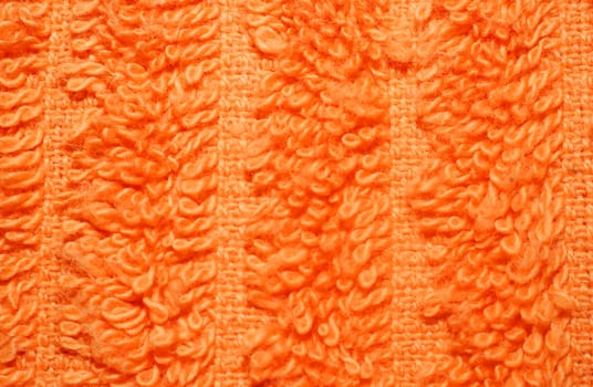  Texture of bright orange terry towels very closeup                              