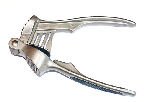 Metal garlic press isolated closeup                               