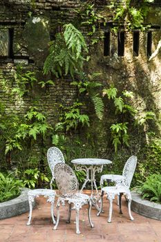 White vintage chairs in the garden
