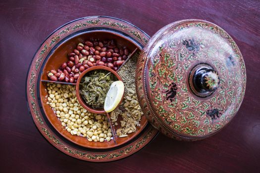 A selection of typical Myanmar snacks: tasty and spicy seeds, nuts and pickled tea leaves.