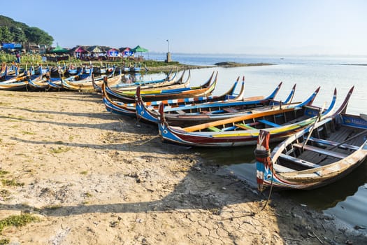 Wood boat Myanmar style at Ubein bridge. Mandalay. Myanmar