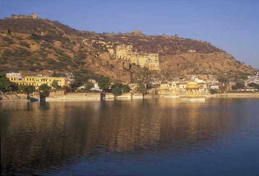 Royal palace and fort on the hillside above a lake. Bundi, Rajasthan, India