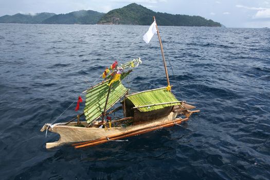 Craft boat floating in ceremony for respect to ancestor of Sea Gypsies moken Thailand