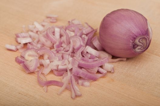 Shallot  peeled on wooden  background