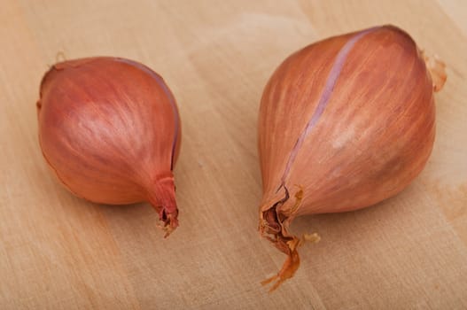 Shallot isolated on wooden  background