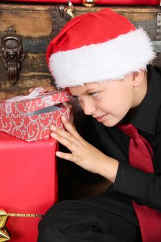 Young boy excited about finding out what his gift is