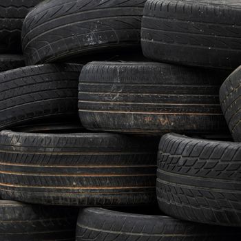 Pile of old rubber tires for background
