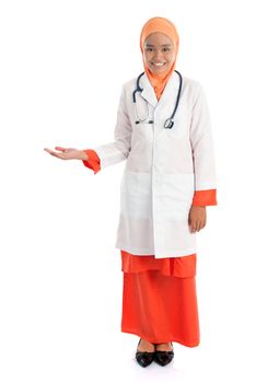Full body young Muslim female doctor portrait, showing welcome hand sign standing isolated on white background.