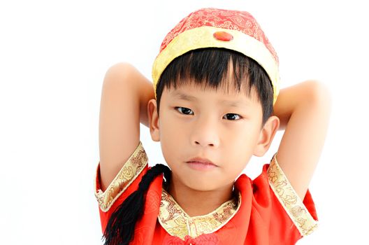 China boy in traditional Chinese red Tang suit greeting