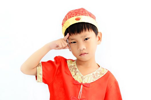 China boy in traditional Chinese red Tang suit greeting